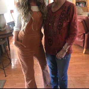 Lida Kate burnt Orange corduroy zip up overalls with frayed flare bottom. Sz S